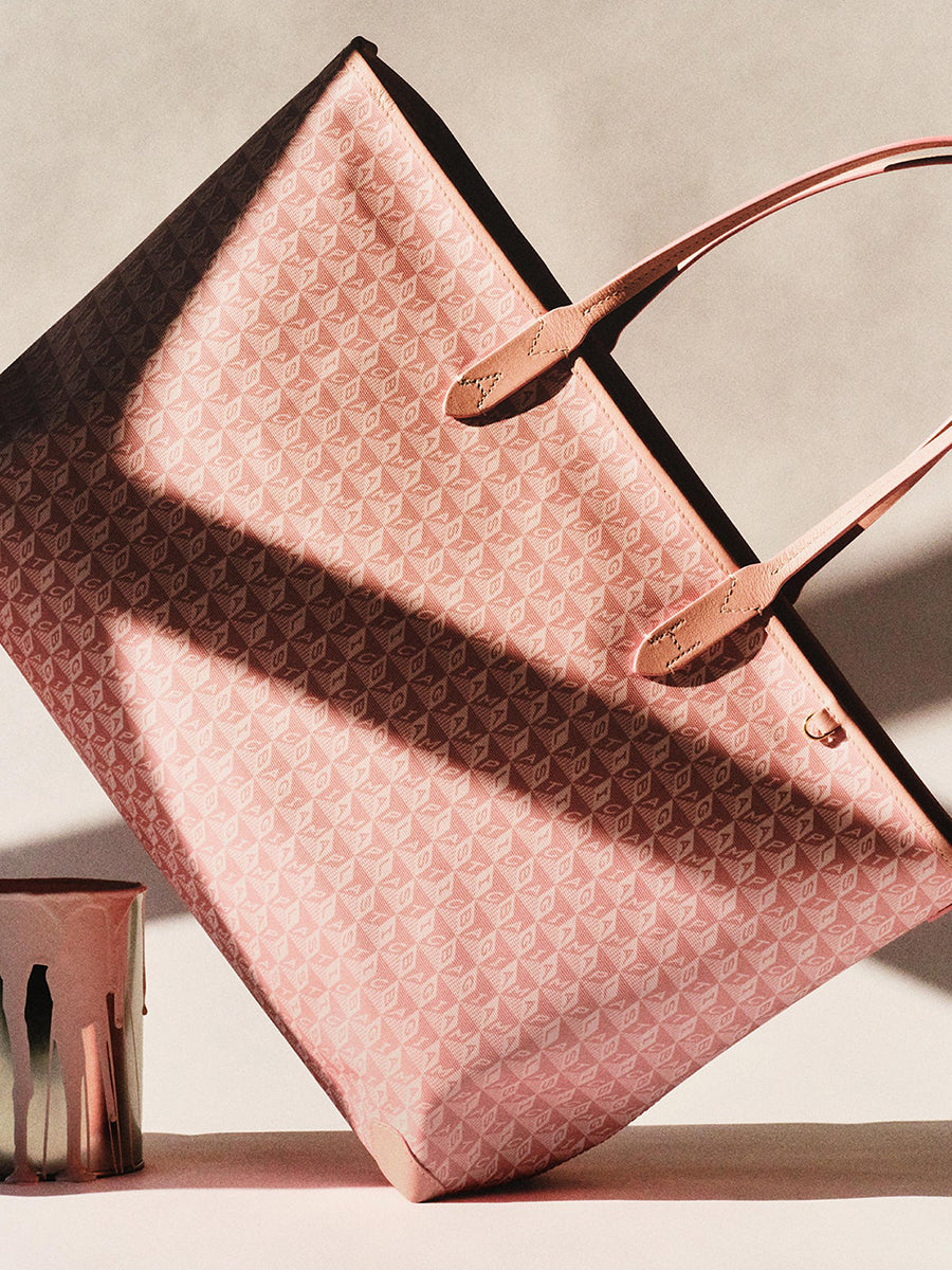 I am a Plastic Bag Zipped Tote in Shell Pink Monogram