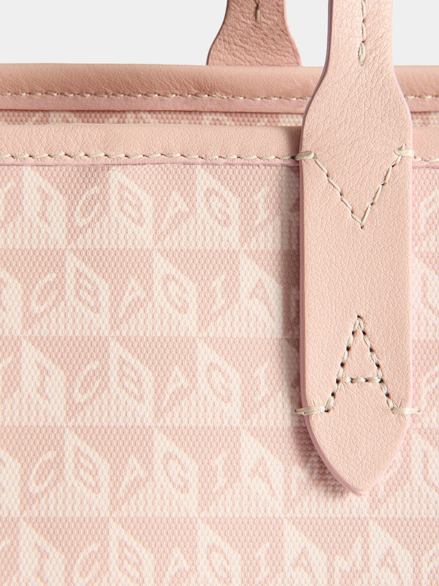 I am a Plastic Bag Zipped Tote in Shell Pink Monogram