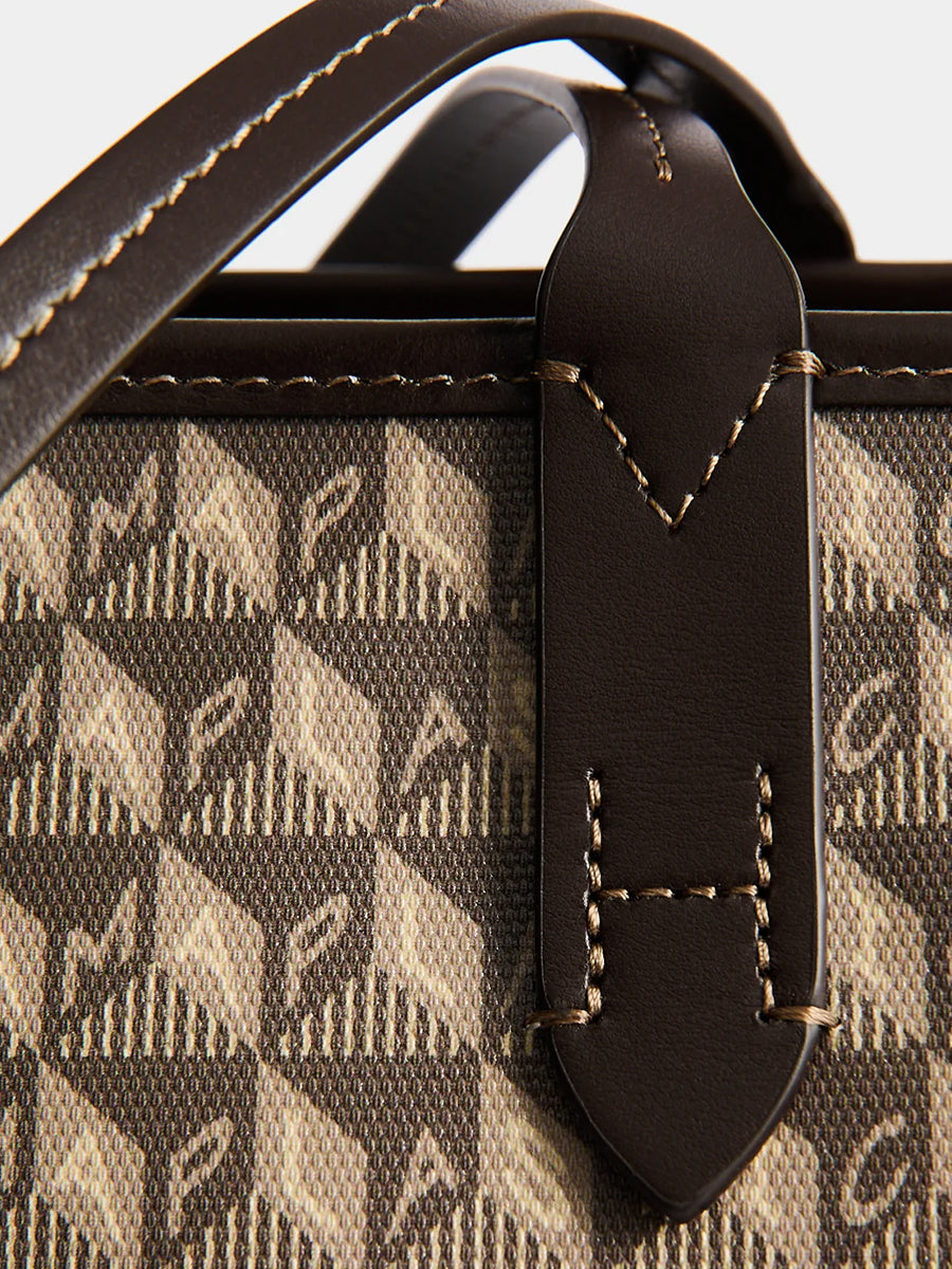 I am a Plastic Bag Zipped Tote in Truffle Monogram