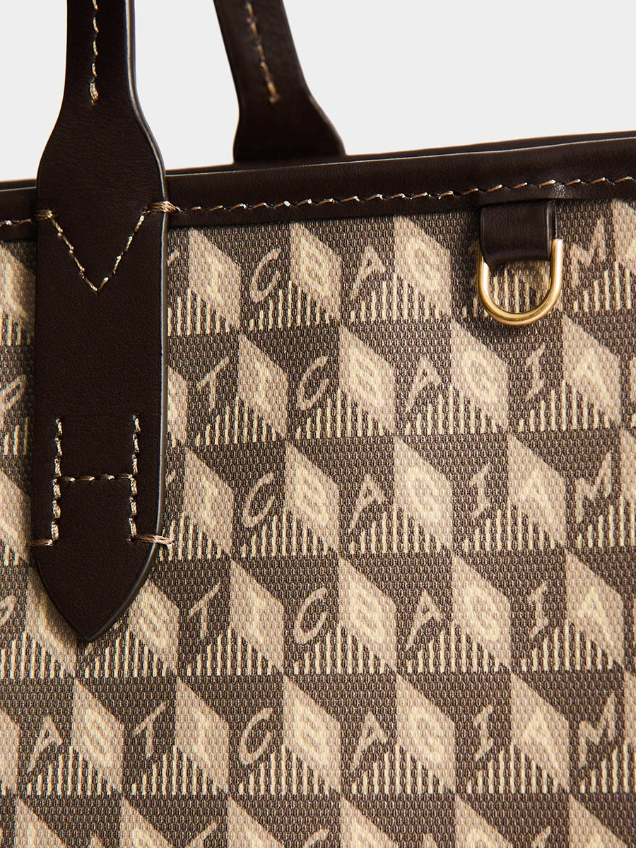 I am a Plastic Bag Zipped Tote in Truffle Monogram